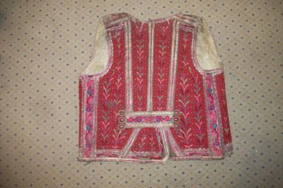 null Waistcoat in turned over skin, Romania, densely embroidered in red flowers,...