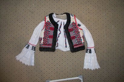 null Vest Mara Muresh, Romania, white skin embroidered with polychrome wool of flowers,...
