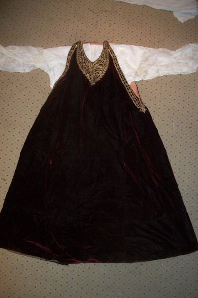 null Dress, Turkey, circa 1900, red silk velvet, gold embroidered bib. Attached is...