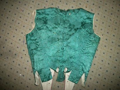 null Camisole with compères, 18th century, moire with green spinach border, decoration...
