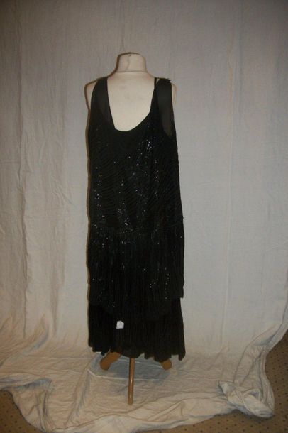 null Dress, circa 1930, black crepe, embroidered with black glass beads. Strapless...