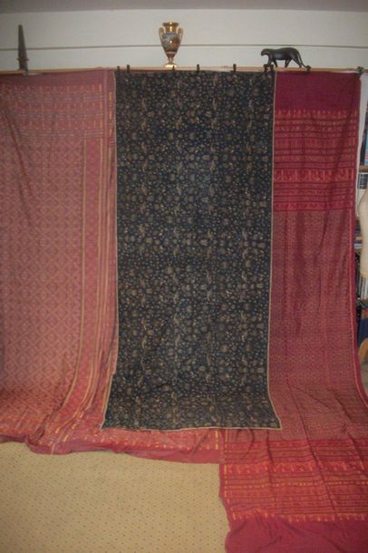 null Meeting of three ikat, Indonesia, red background with geometric pattern and...