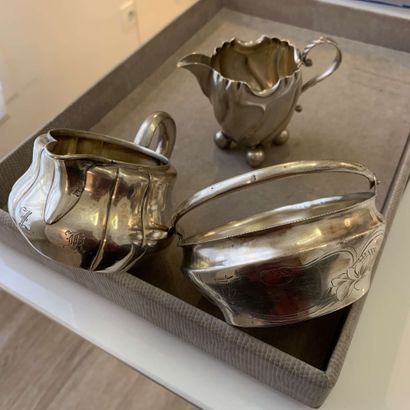 null 
LOT in silver (min 800‰) comprising: - two milk POTS, one with flat monogrammed...