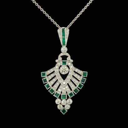 null A "stylized feather" pendant and its chain, in openwork white gold (750‰) set...