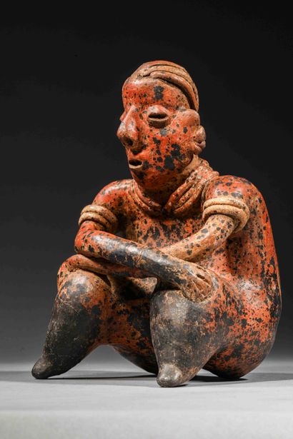 null Seated figure holding a command staff

Brown terracotta with red and cream slip....