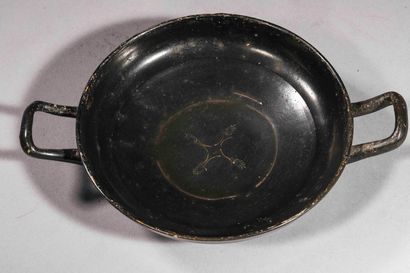 null Cup with black glaze and stamped decoration of four palmettes

Ochre terracotta...