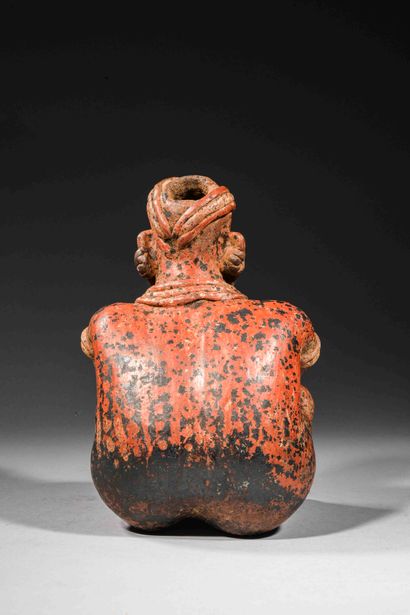 null Seated figure holding a command staff

Brown terracotta with red and cream slip....