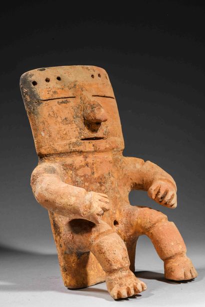 null Seated stylized figure

Brown clay with traces of manganese oxide

Quimbaya...