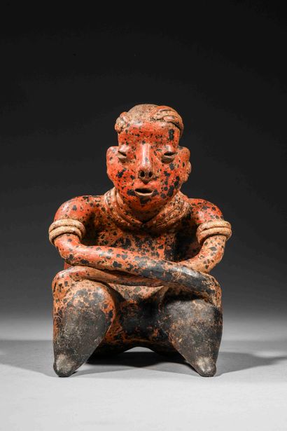null Seated figure holding a command staff

Brown terracotta with red and cream slip....