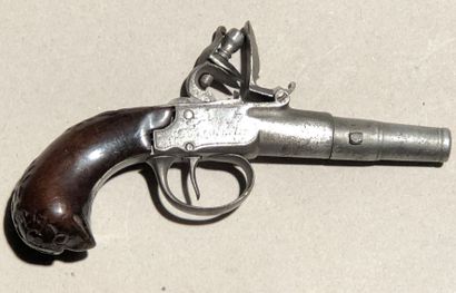 null Flintlock travel pistol. 

Round barrel with forced bullet. Chest engraved with...