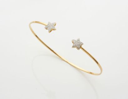 null BRACELET fin " deux étoiles " ouvert en or jaune (750) partiellement serti de...