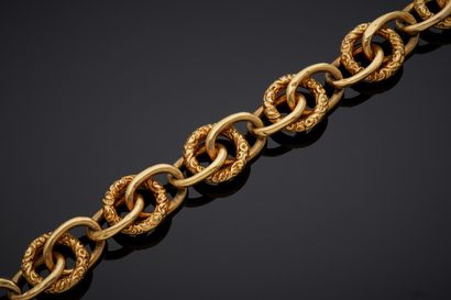  Important yellow gold (750‰) openwork BRACELET with partially chased oval and circular...