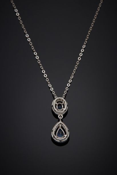 null A white gold (750‰) pendant set with two oval and pear-shaped sapphires, surrounded...