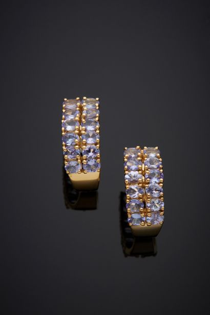  Pair of vermeil (925‰) EARRINGS set with two alignments of tanzanites in oval form....