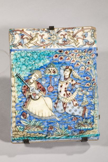 null 
Tile with entertainment scene

Siliceous paste with polychrome decoration under...