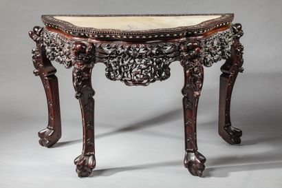 null Important console in exotic wood, large carved decoration and inlaid mother-of-pearl...