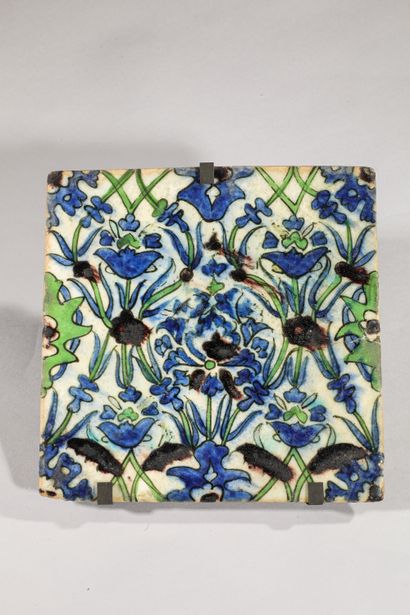 null 
Floral tile

Siliceous paste with polychrome decoration under transparent colorless...