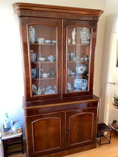 null Mahogany veneered sideboard with two glass doors in the upper part and two solid...