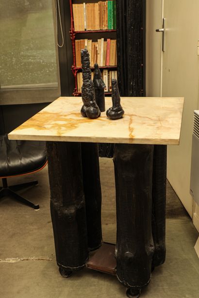 null Table on wheels

81x60x60cm



4 blackened logs, top