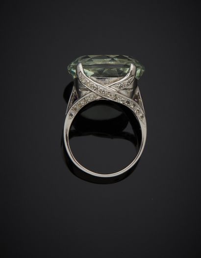 null Silver ring (min. 800‰) openwork, set with an oval prasiolite, shouldered with...