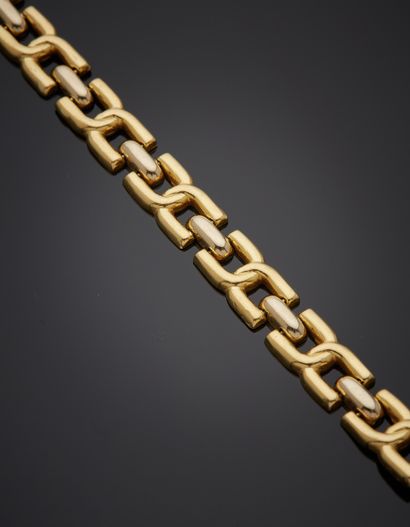 null Yellow gold and white gold (750‰) articulated and openwork BRACELET with interlocking...