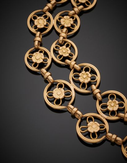 null Yellow gold BRACELET (750‰) with openwork circular links, centered with cut...