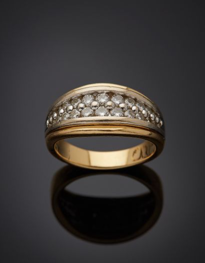 null Yellow gold and white gold (750‰) godronné ring set with two alignments of falling...
