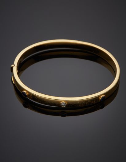 null Yellow gold (750‰) opening rigid BRACELET with three screw motifs, set with...