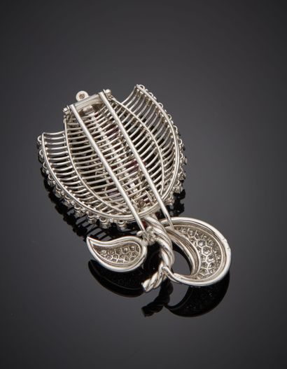 null Platinum (950‰) and white gold (750‰) openwork, twisted "stylized flower" CORSAGE...