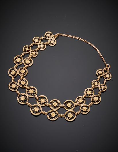 null Yellow gold BRACELET (750‰) with openwork circular links, centered with cut...