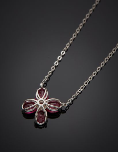 null White gold (750‰) "flower" pendant set with four oval rubies, centered with...