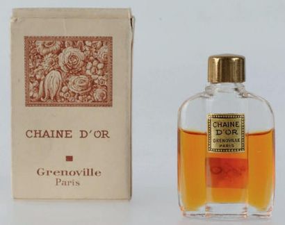 Grenoville «Extrait chaine d'or» Flacon miniature en verre, décor perlé. Bouchon...