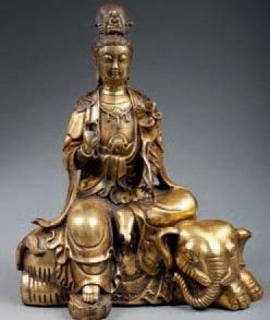 null KWAN-YIN forme féminine de Bouddha assise sur un éléphant, bronze doré. Tibet....