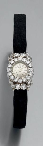 null PIAGET BRACELET MONTRE de dame ronde en or gris (750 millièmes). Lunette et...