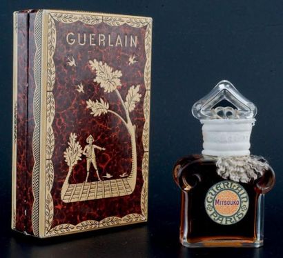 Guerlain «MITSOUKO» Flacon en verre, modèle «bouchon coeur», étiquette circulaire...