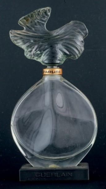 Guerlain «PARURE» Flacon en verre, figurant un galet poli par le temps. Le bouchon...