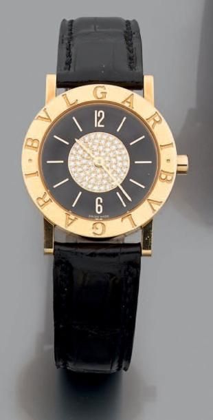 BULGARI BRACELET MONTRE ronde, modèle «Bulgari», en or jaune (750 millièmes). Lunette...