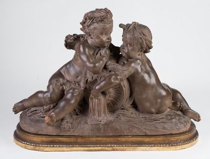 null Terracotta statue representing two cherubs on a gilded wood base, in porcelain,...