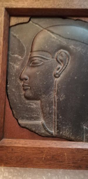 null Fragmentary bas relief representing a woman's profile on the left.
She is wearing...