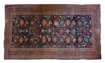 null A large woollen rug measuring 3.90cm x 2.55cm.