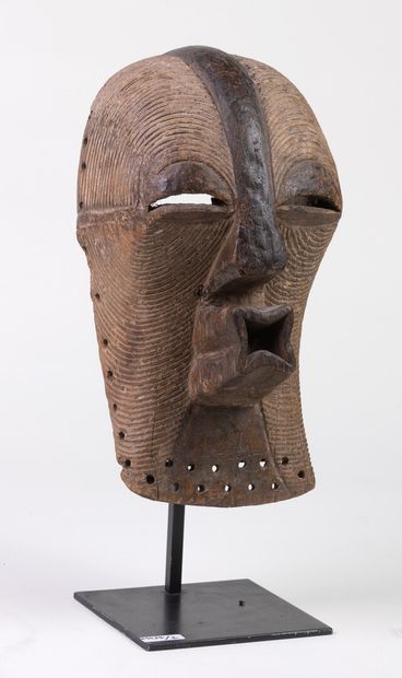 null Female "KIFWEBE" mask of the "Kikashi" type with a rounded forehead and a very...