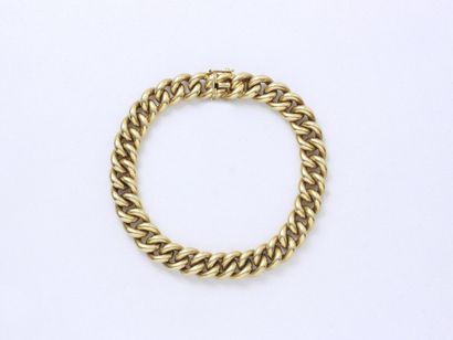 null Bracelet in gold 750 thousandth, curb chain, decorated with a clasp with eight...
