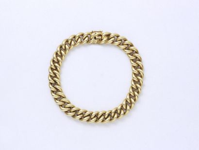 null Bracelet en or 750 millèmes, maille gourmette, agrémenté d'un fermoir à cliquet...