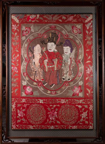 null Chinese embroidery showing a red background embroidered with golden threads...