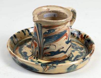  Infreville a set composed of a pitcher and a plate in terra cotta and polychrome...