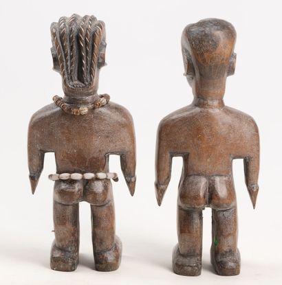 null EWE TOGO Couple of wooden statuette with brown patina covered with kaolin. The...