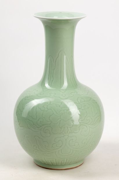  Bottle vase with long neck in porcelain with celadon glaze, frieze of banana leaves...