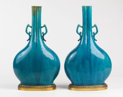  Pair of turquoise ceramic amphora vases...