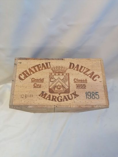 null 
12 Bottles Chateau Dauzac Grand Cru Classé 1855 of 1985 Margaux, in wooden...