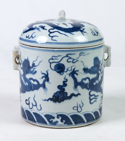 null A porcelain covered pot decorated with dragons and clouds in blue underglaze...